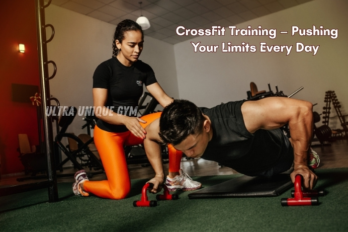 A personal trainer guiding a client through intense push-up exercises during CrossFit training at Ultra Unique Gym in Dindigul